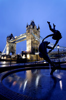 Girl with Dolphin Statue and Tower Bridge
